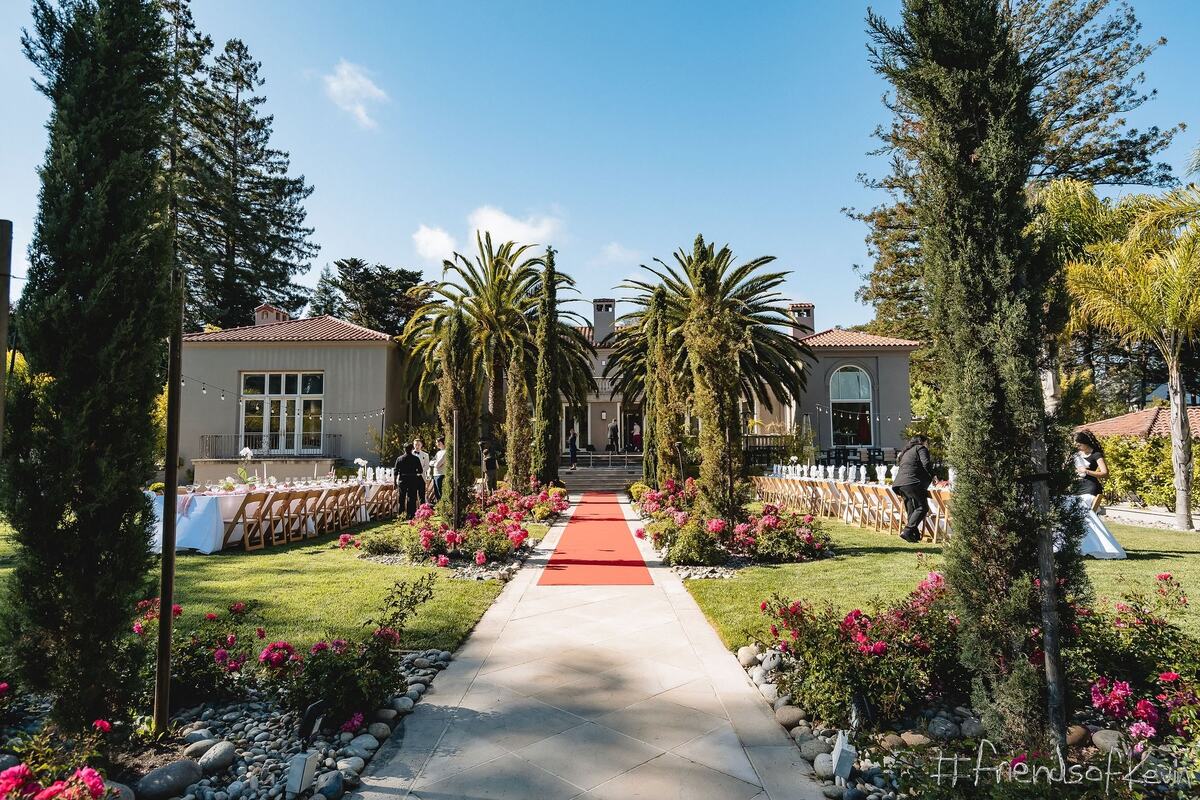 The red carpet running through the estate gardens to the house